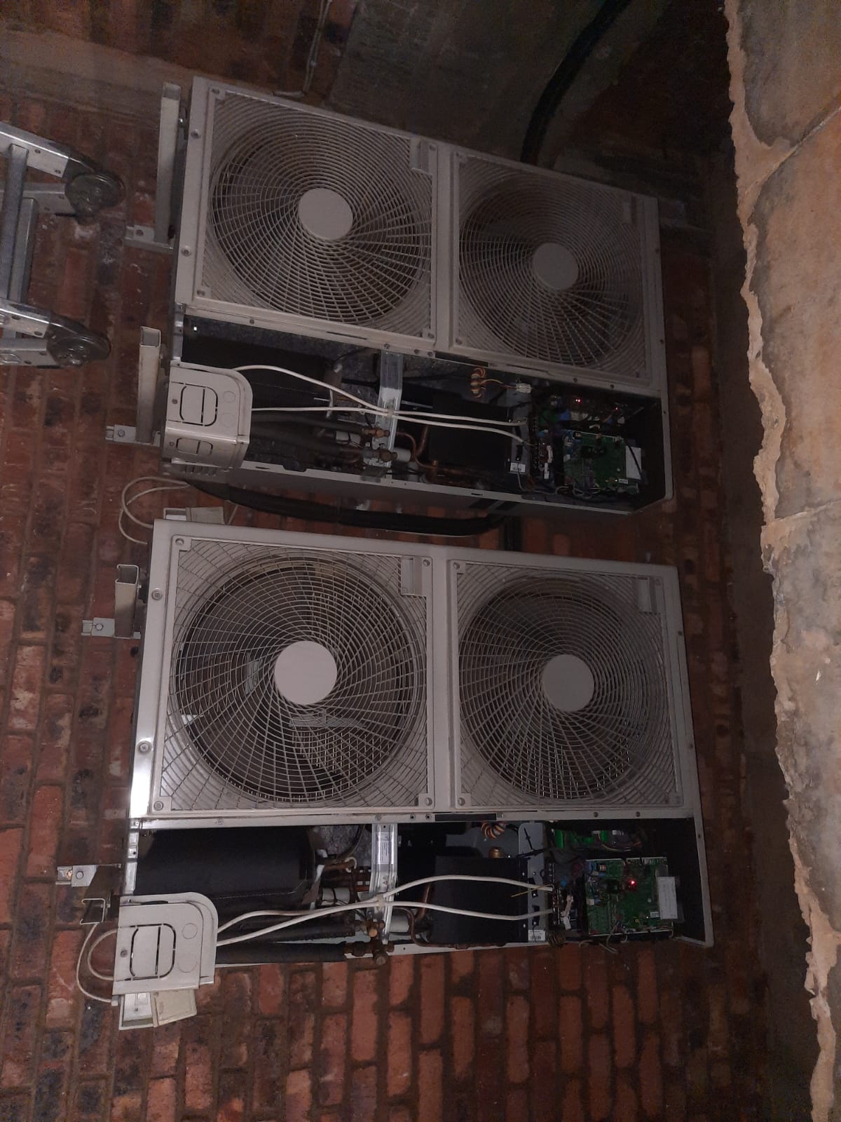 Professional AC installation technician ensuring proper installation